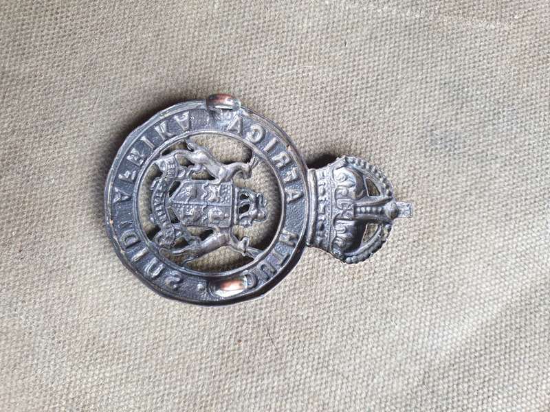 scarce WW2 era South African Instructors Corps metal cap badge - with both rear lugs intact