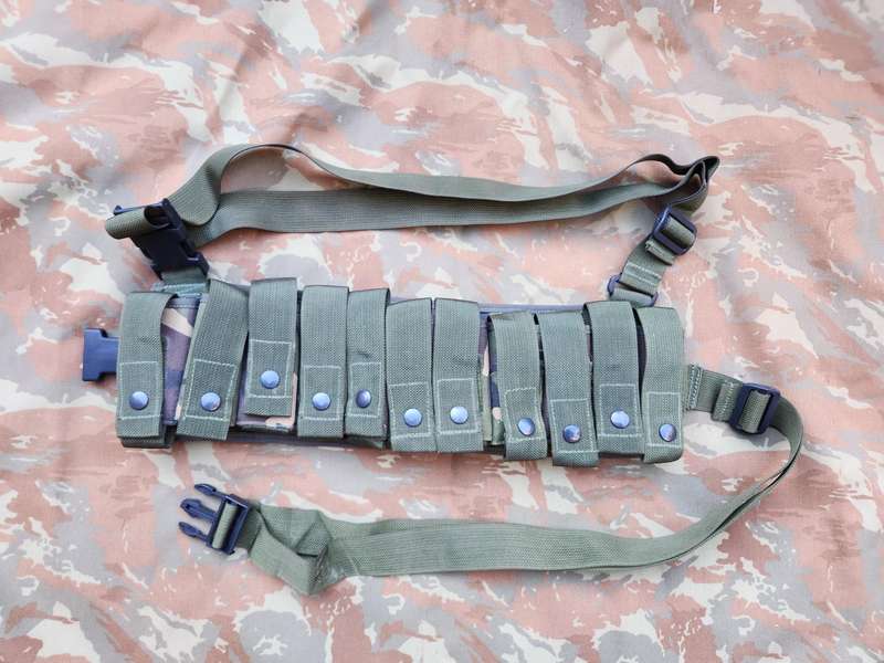 as new & unused scarce & rarely seen UK MoD 40mm ammo bandolier carrier (chest webbing type) in DPM