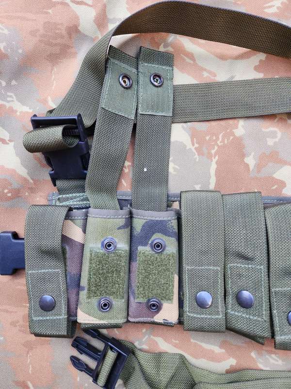 as new & unused scarce & rarely seen UK MoD 40mm ammo bandolier carrier (chest webbing type) in DPM