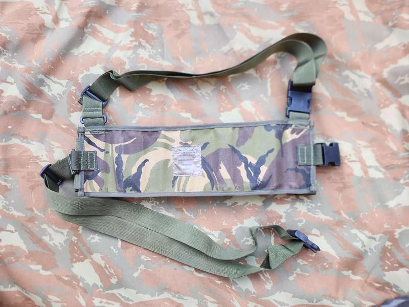 as new & unused scarce & rarely seen UK MoD 40mm ammo bandolier carrier (chest webbing type) in DPM