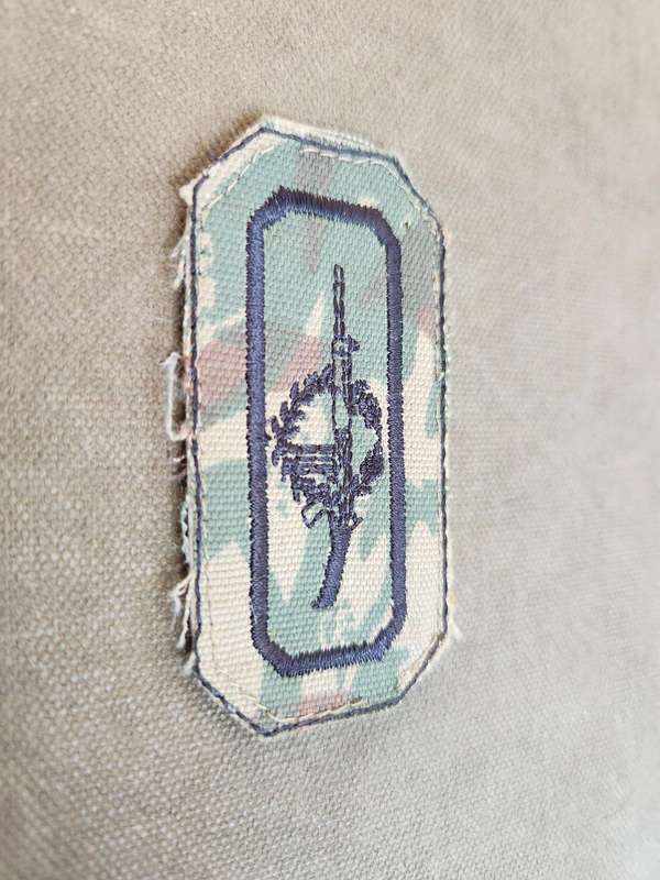 used (removed from uniform) SAP era sniper cloth field-dress badge on SAP 2nd patt camo backing
