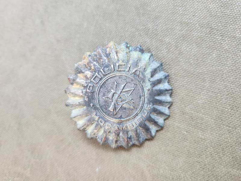 100% original used condition Mozambique PRM (era?) police cap badge with rear screw-post intact