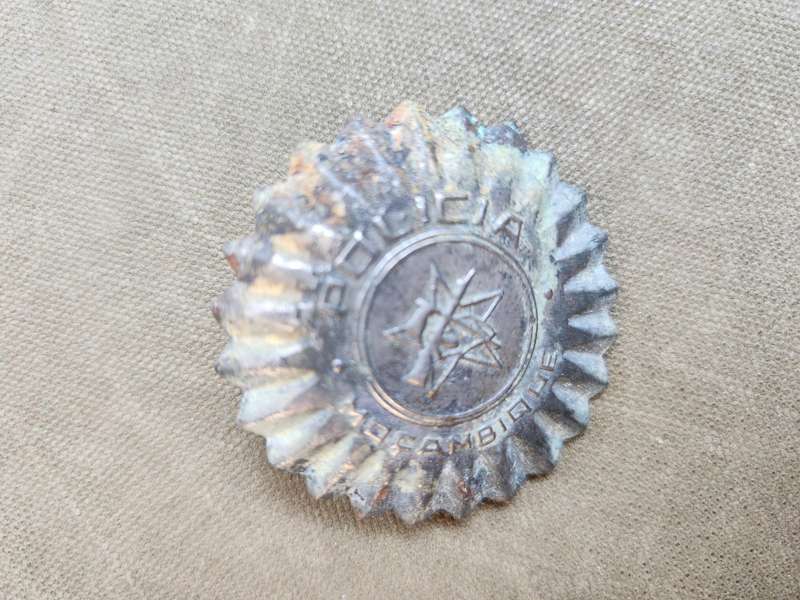100% original used condition Mozambique PRM (era?) police cap badge with rear screw-post intact