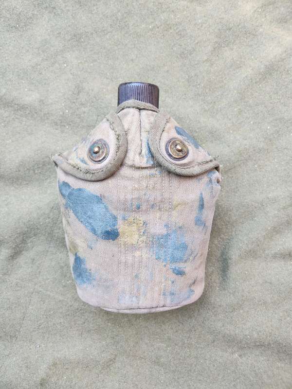 used original US Army dd 1945 canteen and cover with signs of Rhod era custom "baby-poop" camo paint