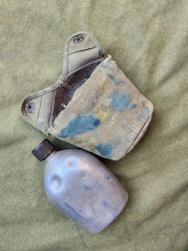 used original US Army dd 1945 canteen and cover with signs of Rhod era custom "baby-poop" camo paint