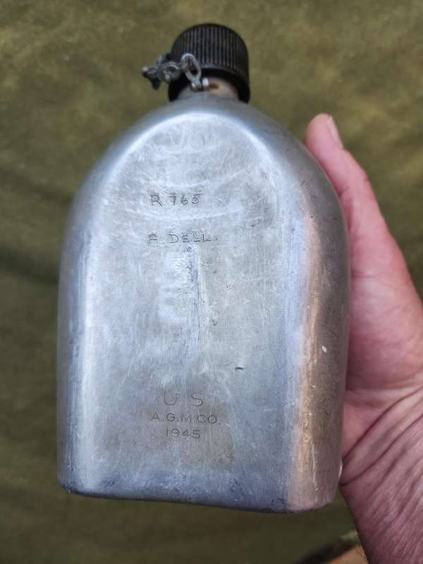 used original US Army dd 1945 canteen and cover with signs of Rhod era custom "baby-poop" camo paint