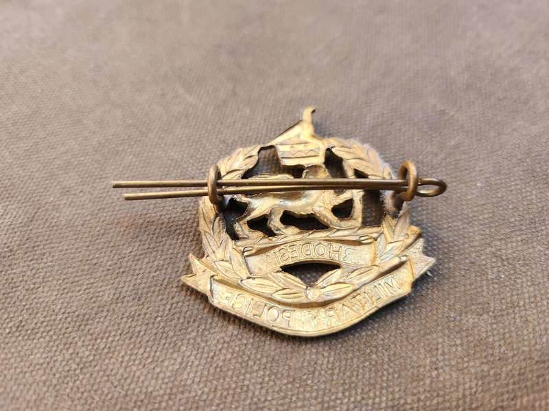 100% original Rhodesia bushwar period metal Military Police cap/beret badge with both rear lugs inta