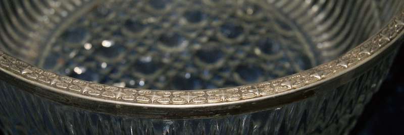 Vintage pressed glass serving bowl with silver plated edge