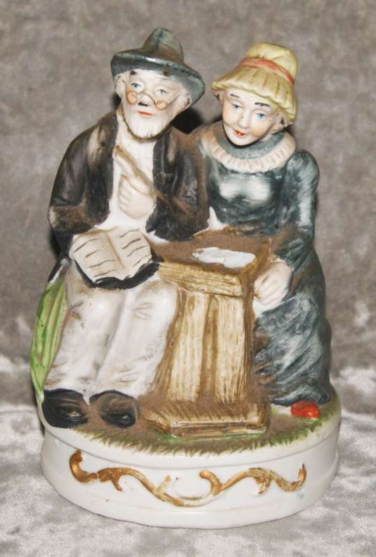 Vintage porcelain statue of old man and woman