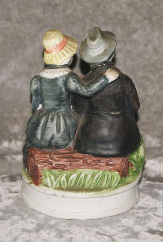 Vintage porcelain statue of old man and woman
