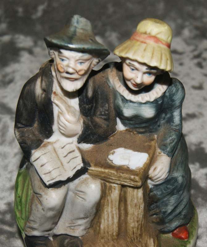 Vintage porcelain statue of old man and woman