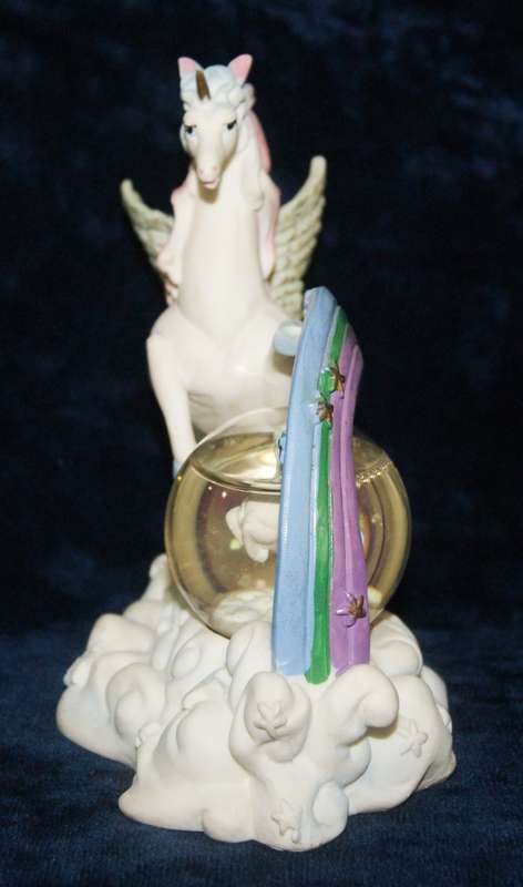 Rainbow unicorn with snow globe