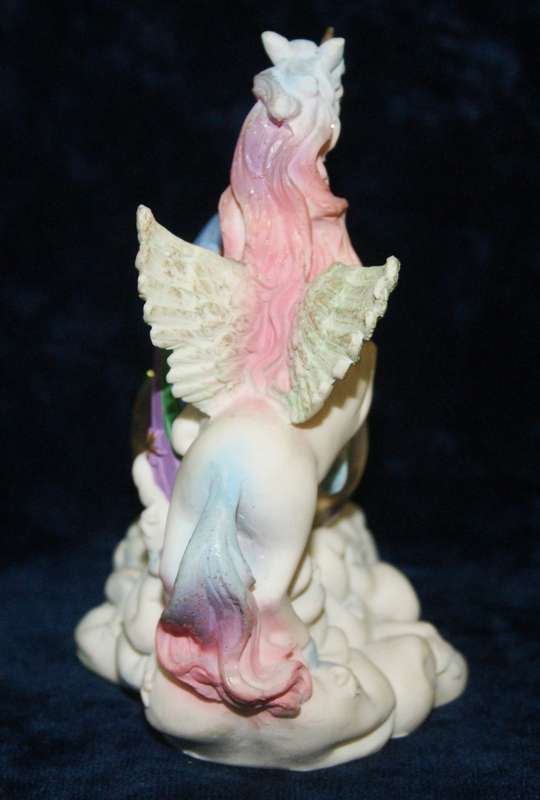 Rainbow unicorn with snow globe