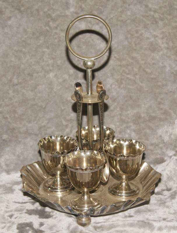 Antique EPNS egg and spoon set on holder (1 mismatched spoon)