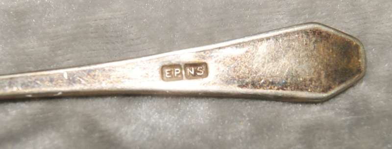 Antique EPNS egg and spoon set on holder (1 mismatched spoon)