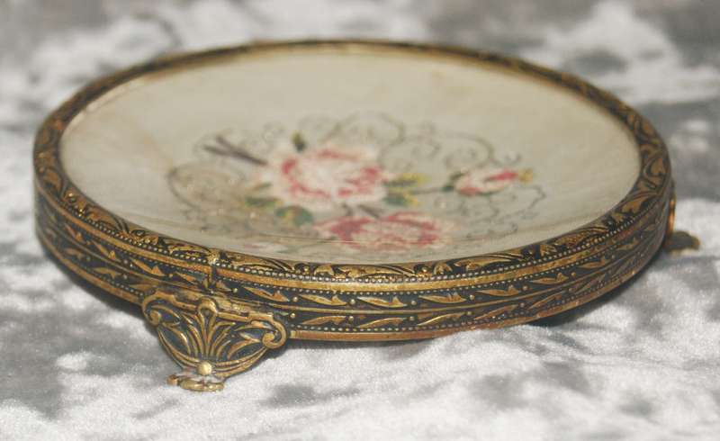 Brass footed pin dish with needlepoint under concave glass