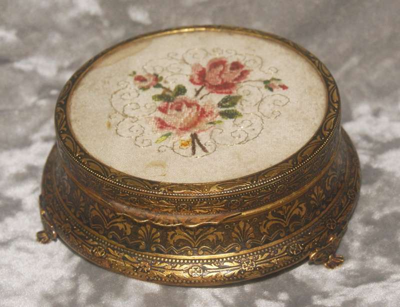 Brass footed high relief trinket box with needlepoint on lid
