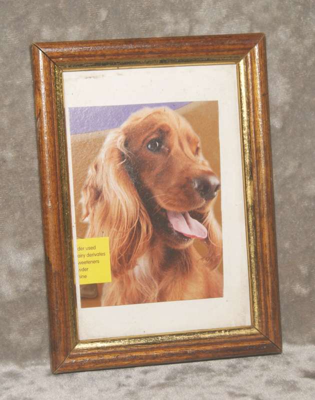 Wooden picture frame with gilt edges