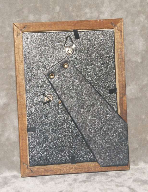 Wooden picture frame with gilt edges