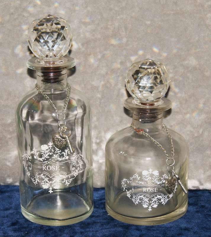 2x Vintage rose decanters with crystal stoppers