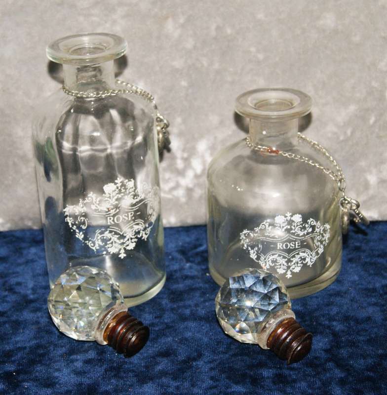 2x Vintage rose decanters with crystal stoppers