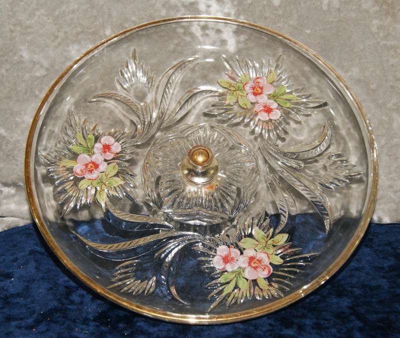 Molded glass pastry serving dish on central column with signed artwork on top