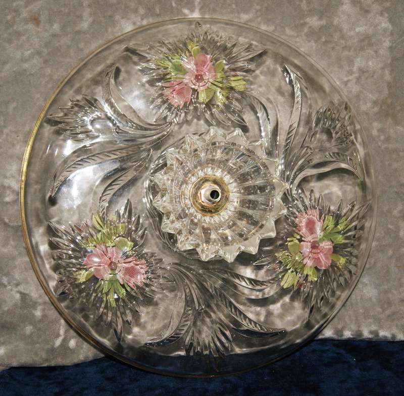 Molded glass pastry serving dish on central column with signed artwork on top