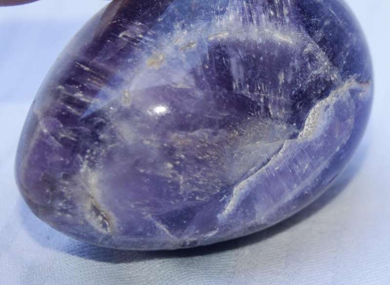 Polished Amethyst egg with brecciated Jasper stand