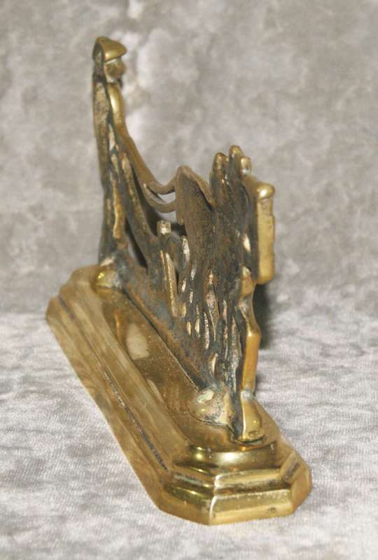 Antique brass doorstop