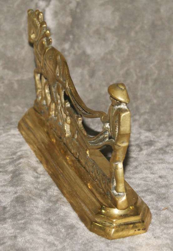 Antique brass doorstop