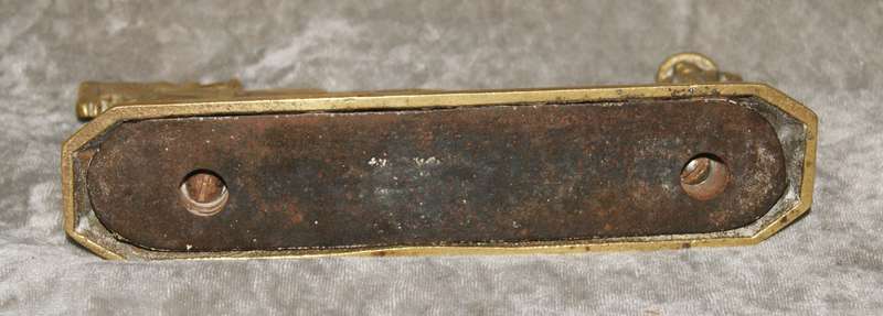 Antique brass doorstop