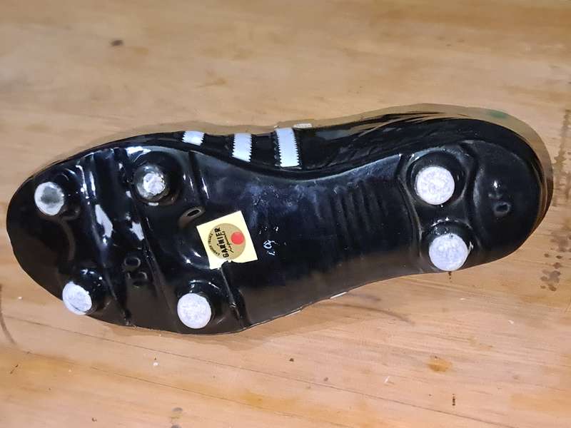 Liquor bottle in the shape of a rugby boot