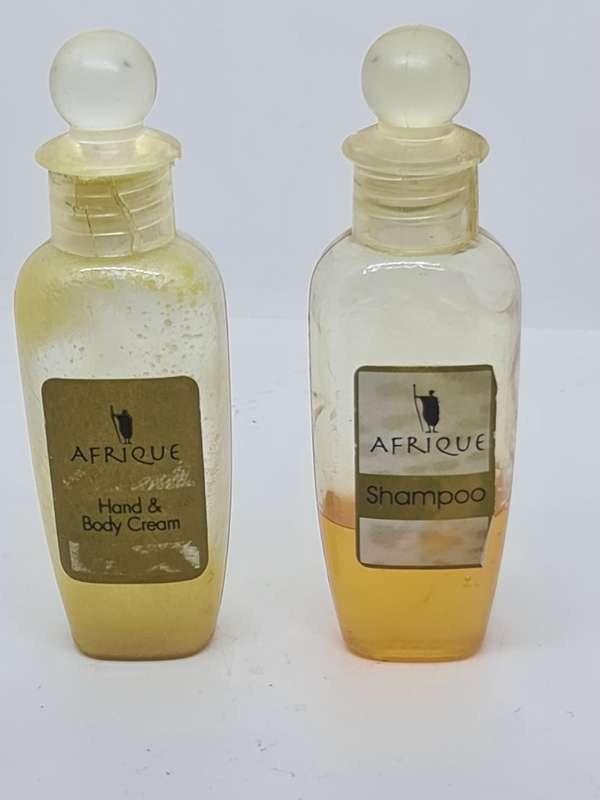 Afrique shampoo and Hand and Body Cream bottles