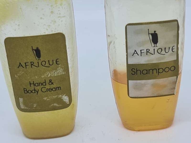 Afrique shampoo and Hand and Body Cream bottles