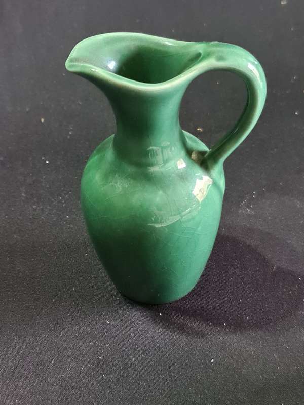 Three ashtrays one Delft and small green jug