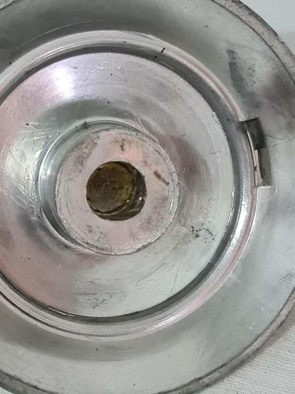 Clock that is not a clock. Small scent bottle inside.  Bottle no lid. Dial damage