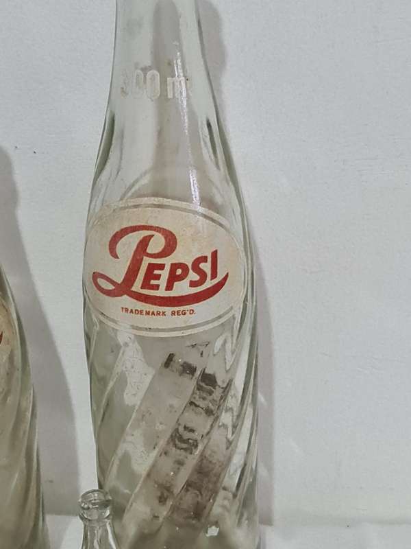 X4 Differant size and age Pepsi Cola bottles.