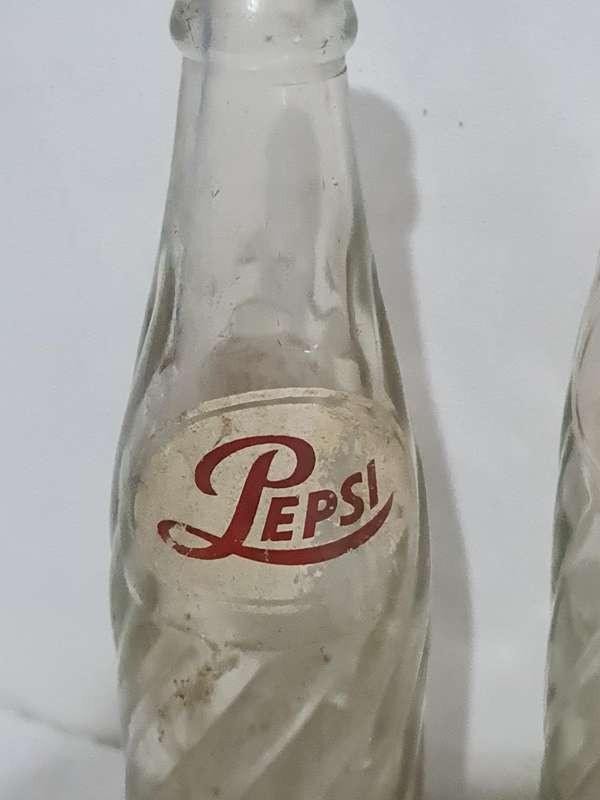 X4 Differant size and age Pepsi Cola bottles.