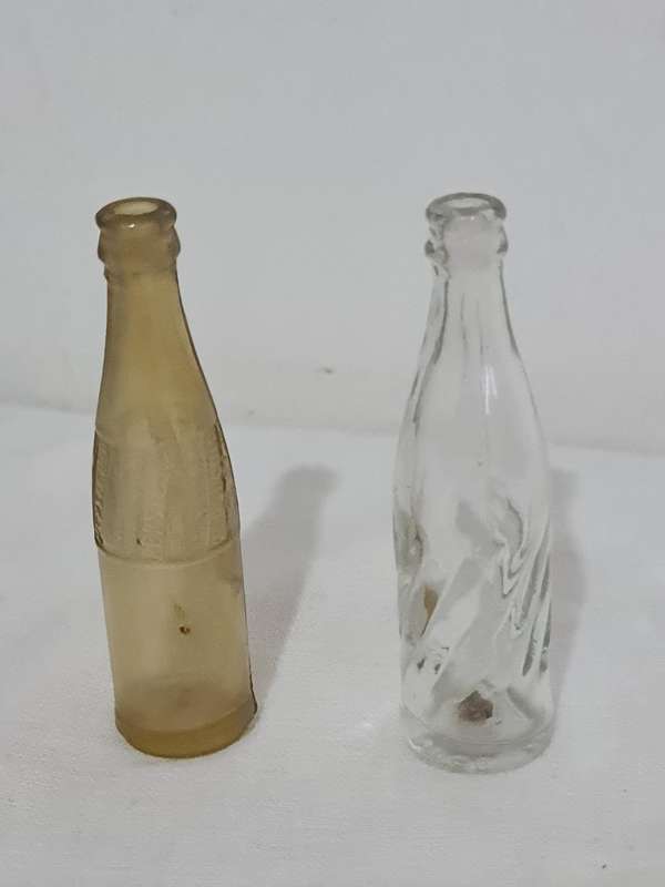 X4 Differant size and age Pepsi Cola bottles.