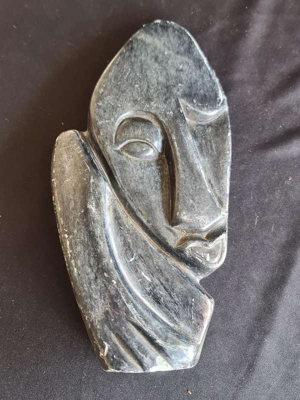 Soap stone carved face