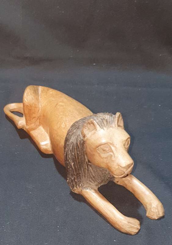 Carved wooden lion figure