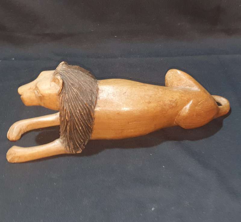 Carved wooden lion figure