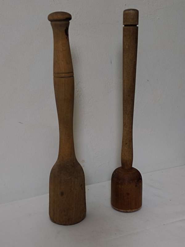 Two wooden pestles