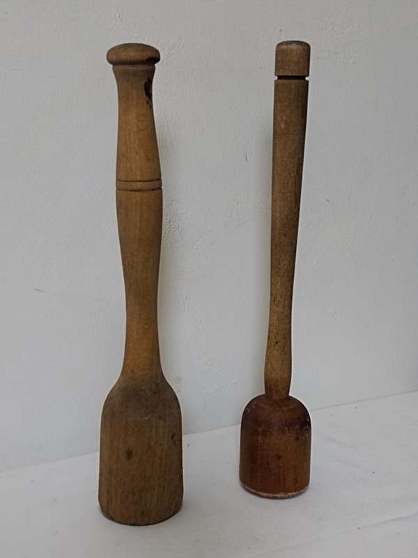 Two wooden pestles