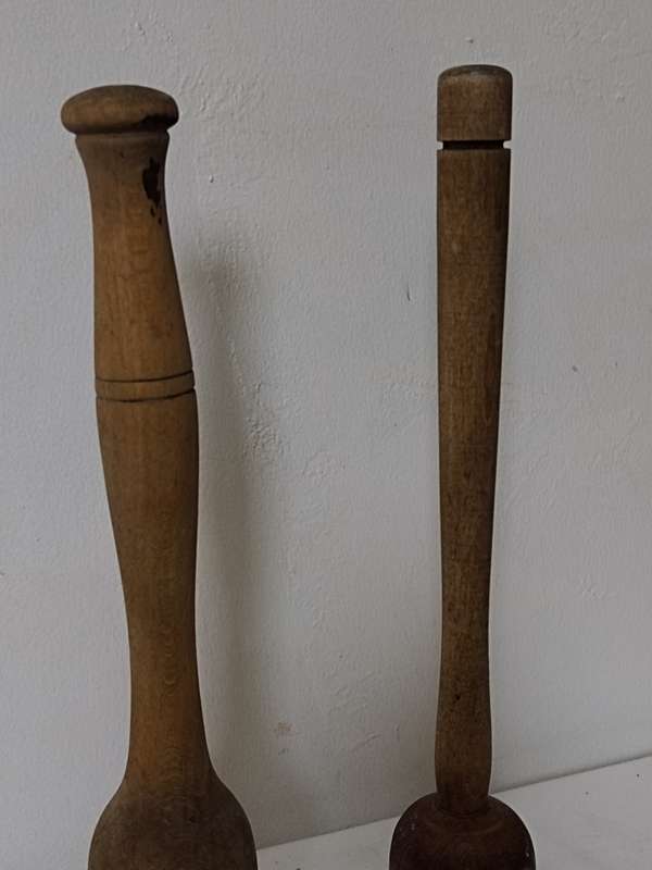 Two wooden pestles