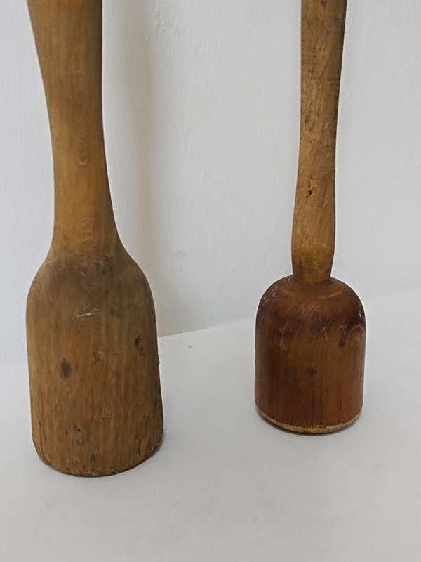 Two wooden pestles