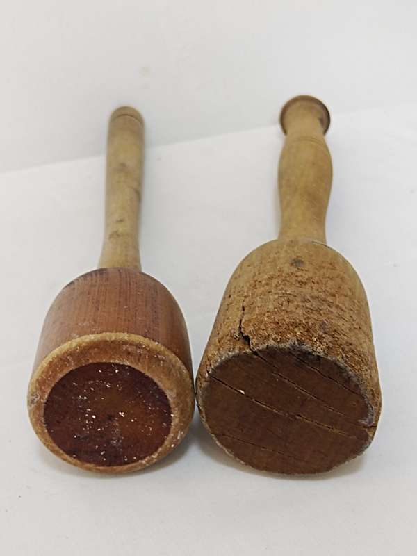 Two wooden pestles