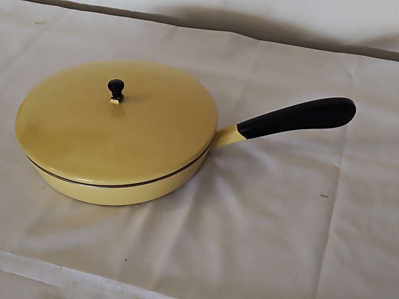 Vintage yellow cast iron pan with lid