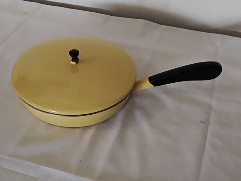 Vintage yellow cast iron pan with lid