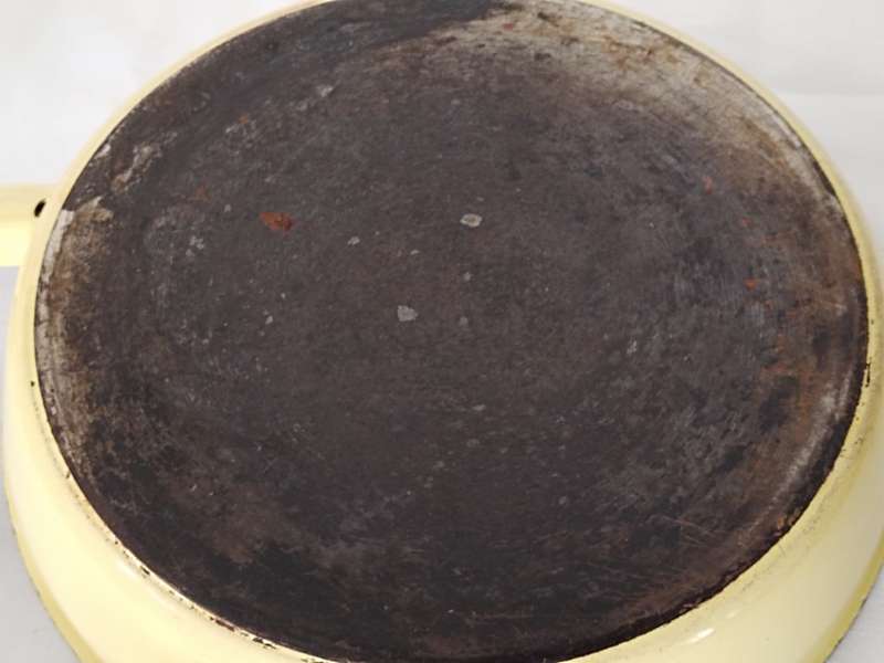Vintage yellow cast iron pan with lid
